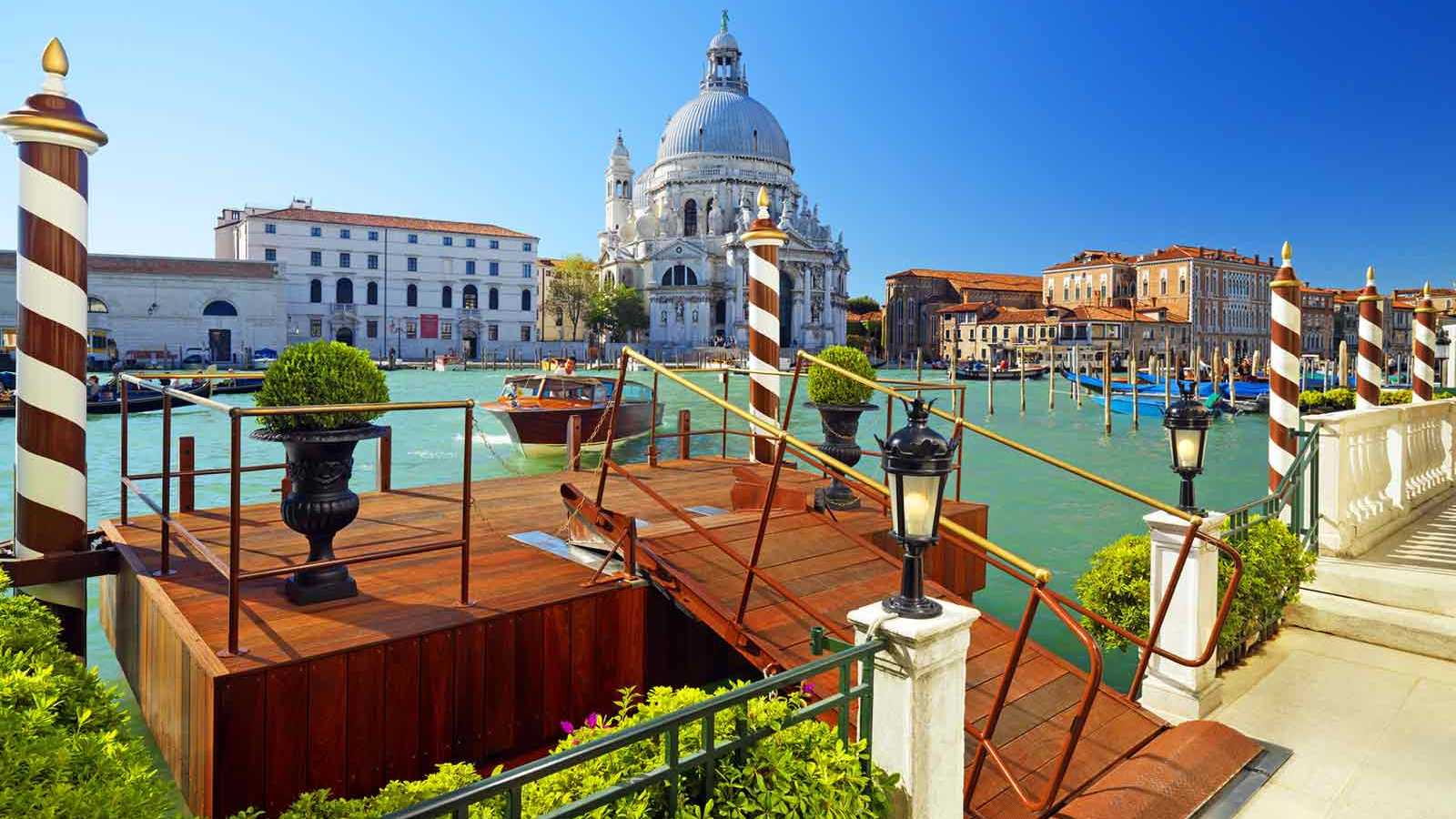 The St. Regis Venice private Grand Canal water entrance with the substantial contemporary Venetian palazzo identity and the dedicated canal orientation evocative of the property's specific Grand Canal luxury configuration