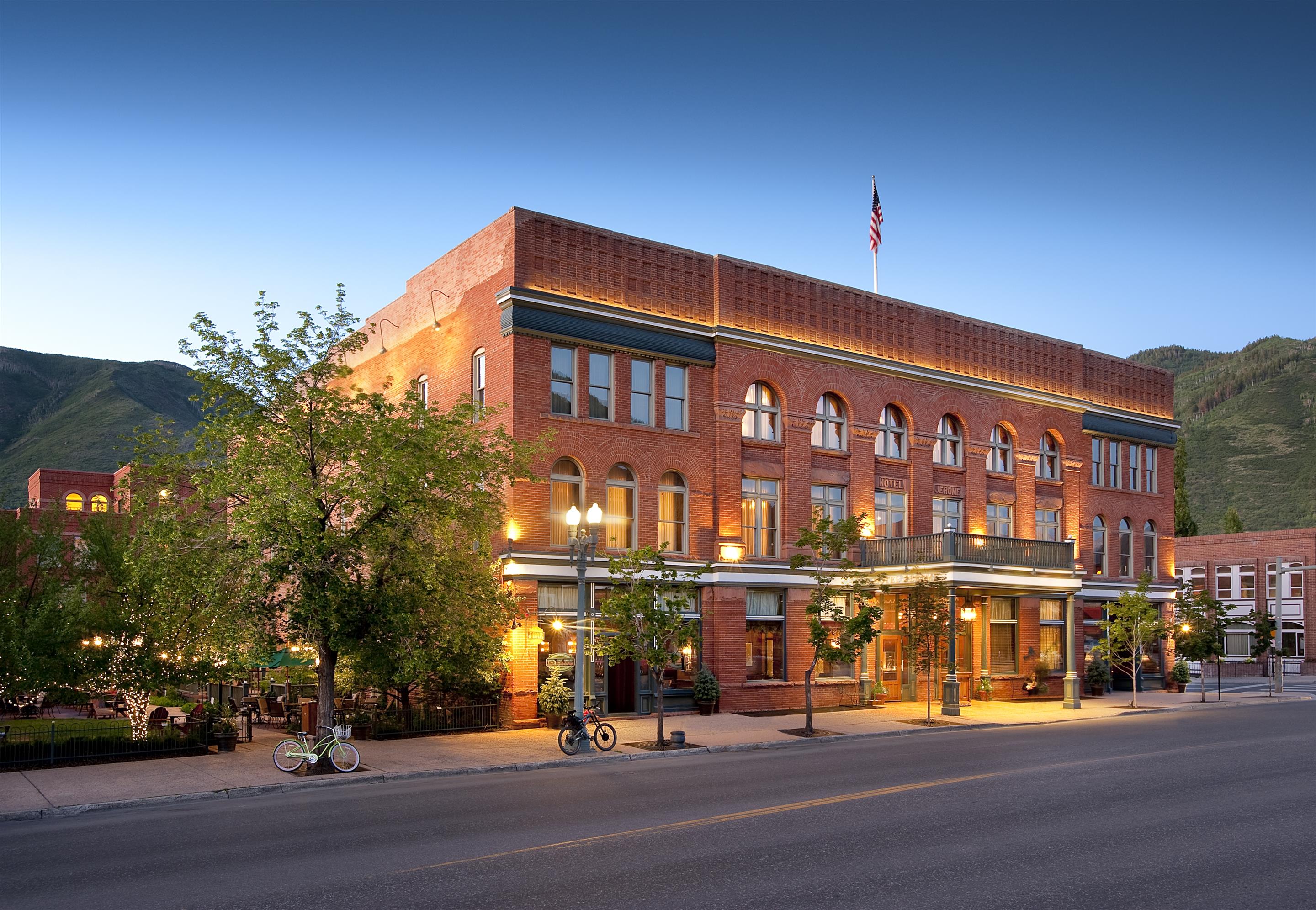 Hotel Jerome in downtown Aspen with the substantial 1889 Victorian red-brick landmark facade and the dedicated mountain-town setting evocative of the property's specific historic Aspen luxury configuration