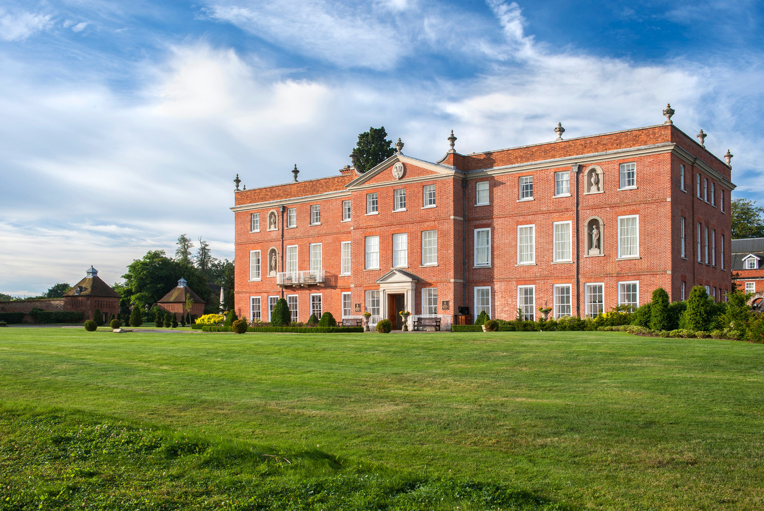 Four Seasons Hotel Hampshire — the substantial Dogmersfield Park 18th-century manor estate set on 500 acres of substantial Hampshire countryside approximately one hour from London with the dedicated equestrian-and-country-estate luxury identity