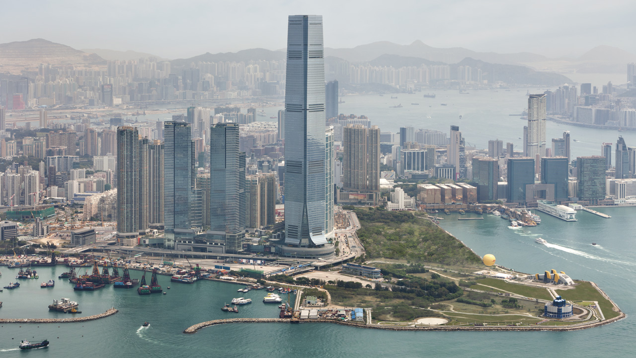 The Ritz-Carlton Hong Kong occupying the top floors of the International Commerce Centre in West Kowloon — among the highest hotels in the world, with the panoramic Victoria Harbour view across to Hong Kong Island