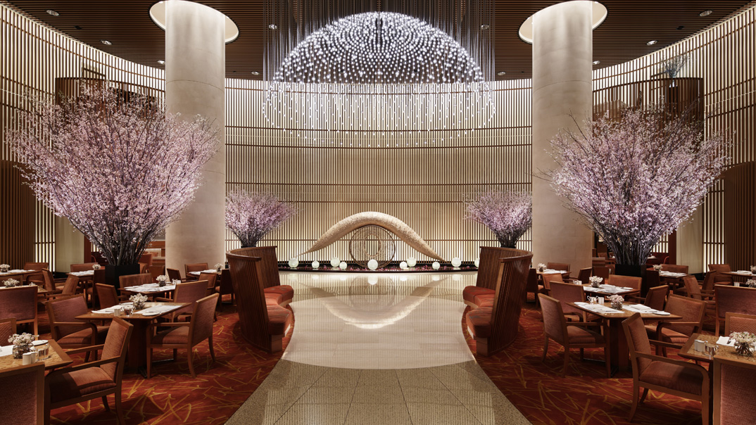The Peninsula Tokyo facing the Imperial Palace and Hibiya Park in Marunouchi — the most architecturally serious Peninsula Hotels expression outside Asia's heritage capitals