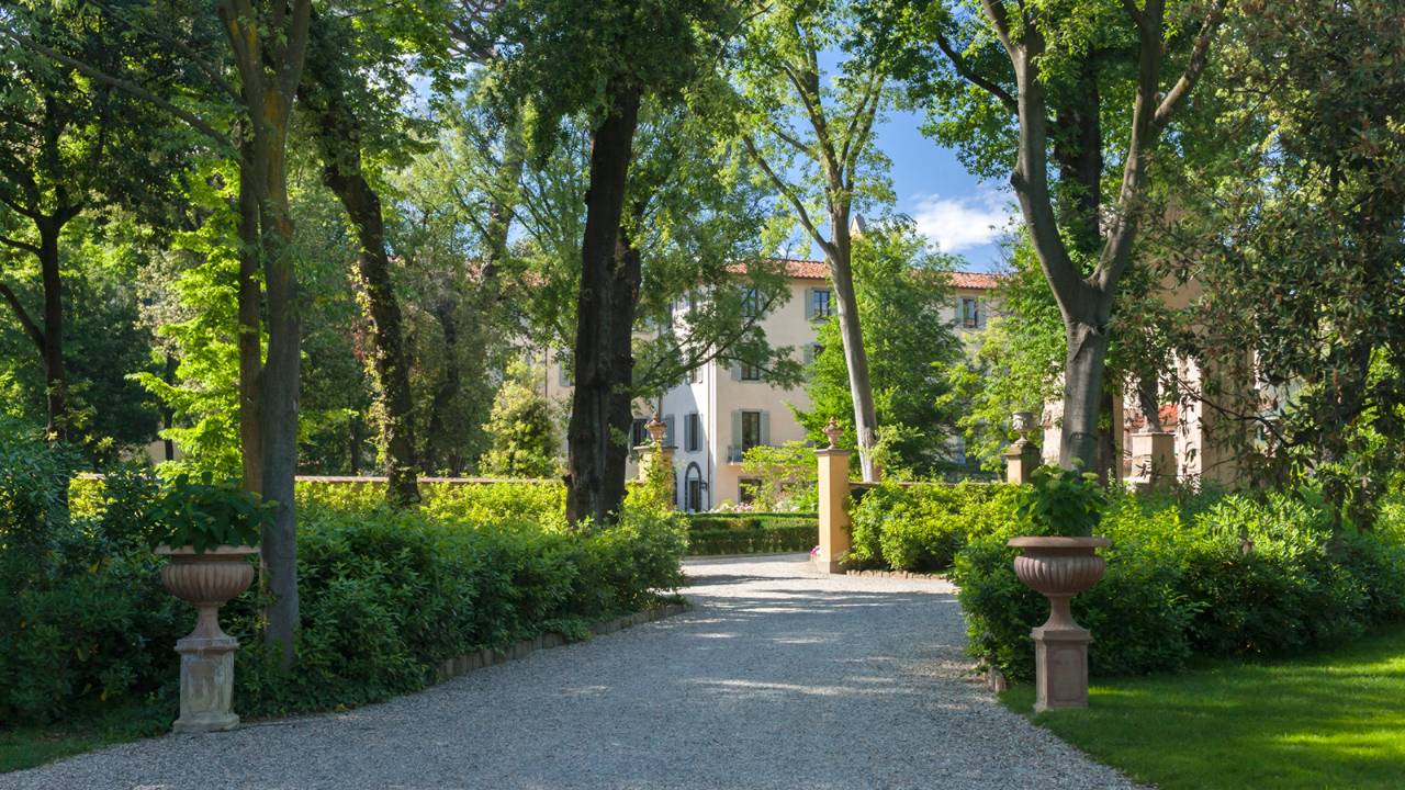 Four Seasons Hotel Firenze set within the 15th-century Palazzo della Gherardesca and its 11-acre private Renaissance garden — the largest private garden in central Florence