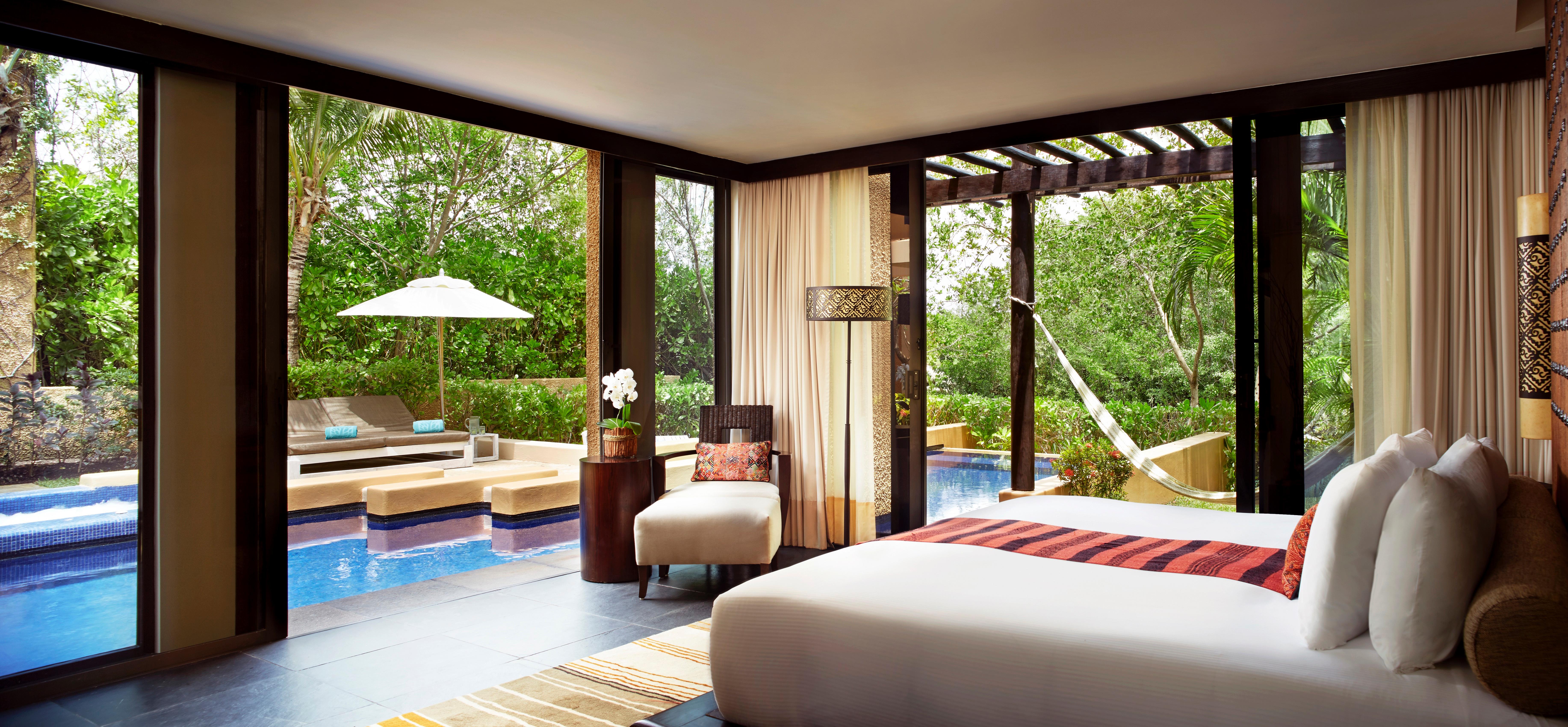 Banyan Tree Mayakoba on the Riviera Maya with the dedicated lagoon-and-mangrove canal system and the substantial private pool villa configurations integrated into the Yucatán jungle landscape
