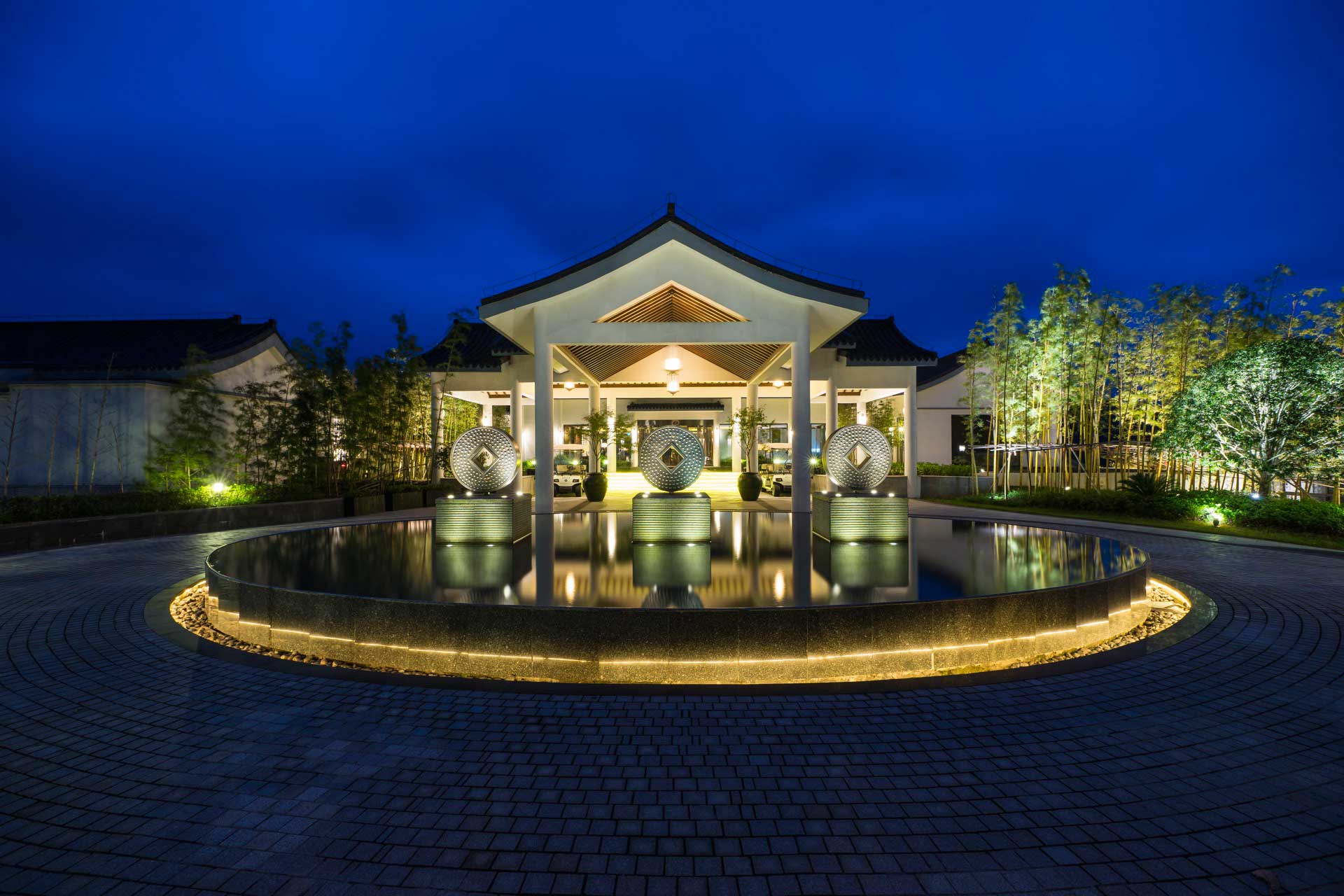 Alila Anji entrance and porte-cochère set within the Zhejiang bamboo forest landscape — the resort's distinctive arrival sequence in eastern China's most environmentally protected region