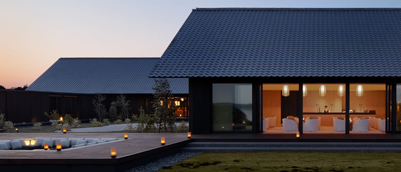 Aman Kyoto set within a secluded private garden at the foot of Mount Daimonji in the northern Kyoto hills, surrounded by moss gardens and forest in the tradition of the Japanese satoyama landscape
