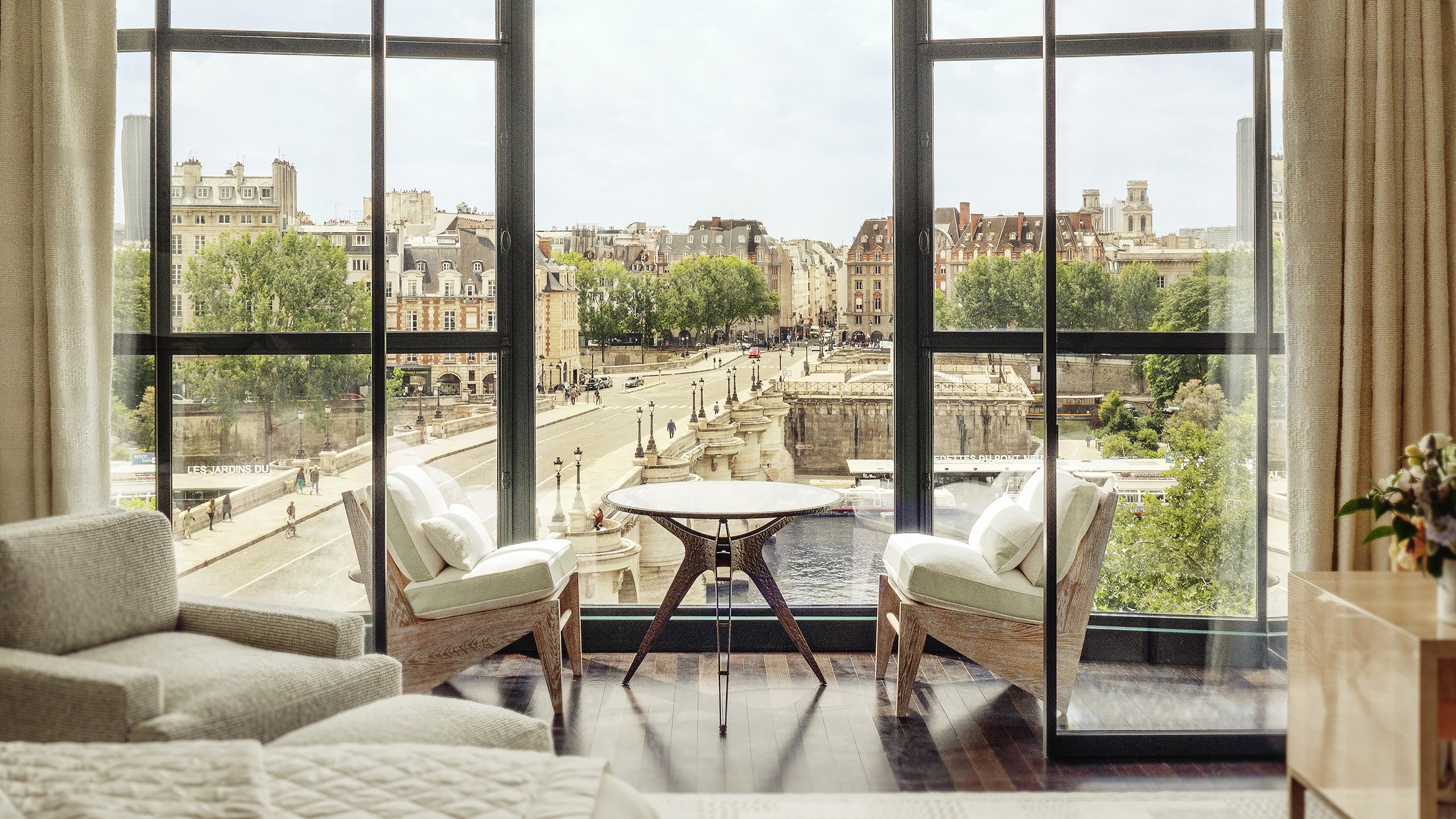 Cheval Blanc Paris in the restored Art Deco La Samaritaine building on the Seine in the 1st arrondissement with views across to the Pont Neuf and the Left Bank — the LVMH flagship Maison in Paris