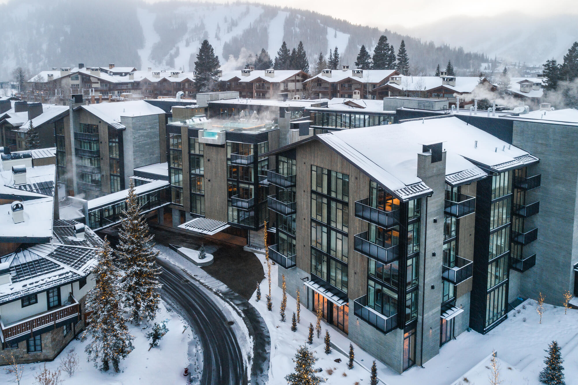 Goldener Hirsch, Auberge Resort at the base of Deer Valley in Park City, Utah — the heritage Austrian Tyrolean Alpine luxury identity adapted to the Rocky Mountain ski resort context