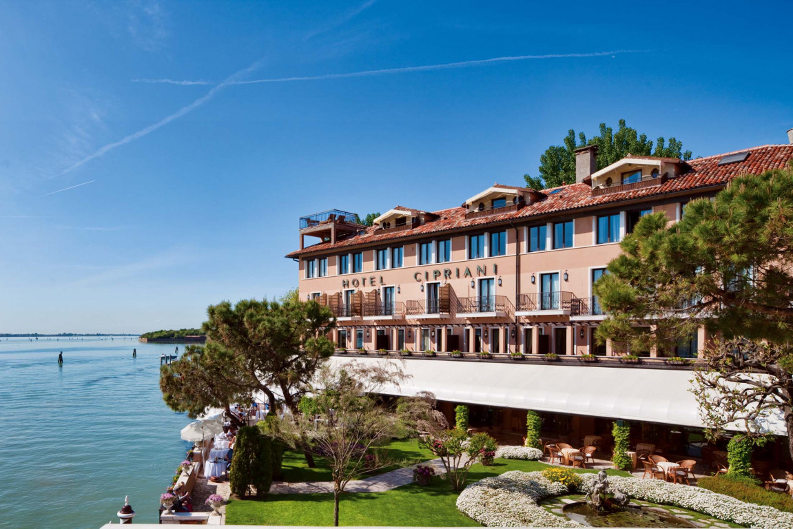 Belmond Hotel Cipriani on Giudecca Island facing St Mark's Square and the Doge's Palace across the Venetian lagoon — the only Venice luxury hotel with a private island setting and the substantial garden grounds