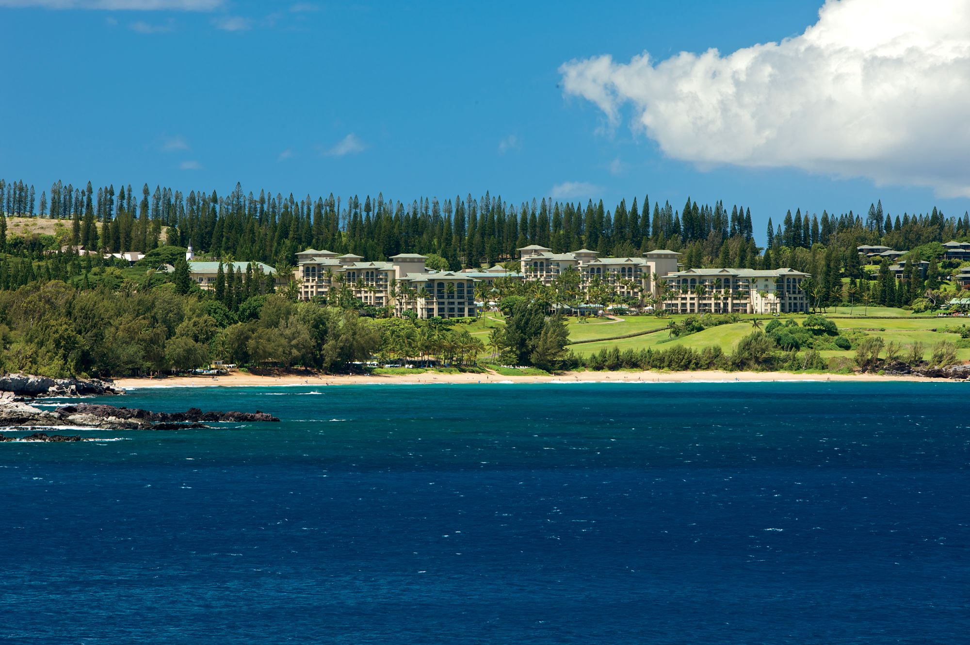 The Ritz-Carlton Maui Kapalua property set on the elevated Kapalua headlands above the Honolua Bay Marine Life Conservation District in West Maui — the only luxury resort in the Kapalua master-planned community