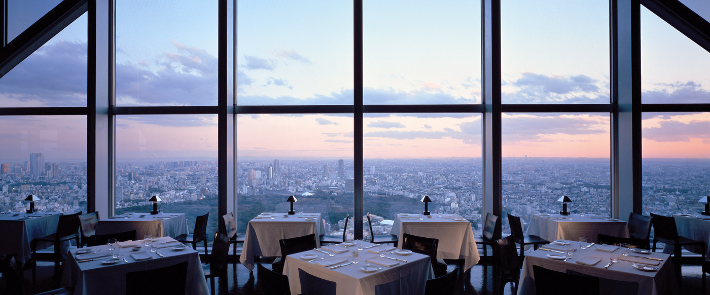 Park Hyatt Tokyo's iconic skyline view from the New York Bar — the 52nd-floor cocktail bar made world-famous by Sofia Coppola's Lost in Translation